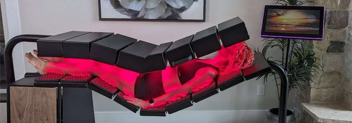 Chiropractic Lincoln NE Red Light Therapy Table With Person